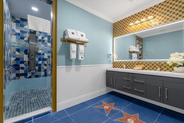 1021 Fantasy Dr, Davenport, FL 33896 - full bathroom featuring double vanity, ornamental molding, a tile shower, wainscoting, and tile patterned floors