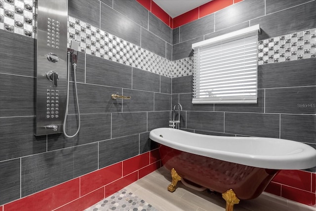 1021 Fantasy Dr, Davenport, FL 33896 - full bathroom with tile walls, a soaking tub, tiled shower, and tile patterned floors