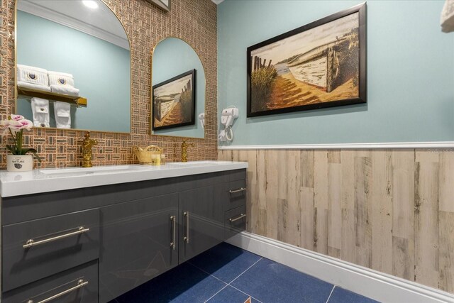 1021 Fantasy Dr, Davenport, FL 33896 - bathroom with a wainscoted wall, vanity, tile patterned floors, and ornamental molding