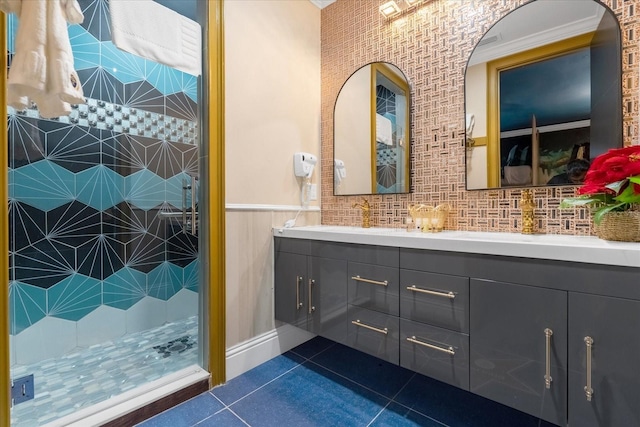 1021 Fantasy Dr, Davenport, FL 33896 - full bath with double vanity, tile patterned floors, tiled shower, and a wainscoted wall
