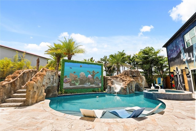 1021 Fantasy Dr, Davenport, FL 33896 - view of pool with a water slide and a pool with connected hot tub