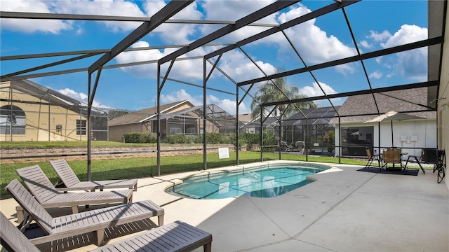 view of pool with a yard, a lanai, and a patio area