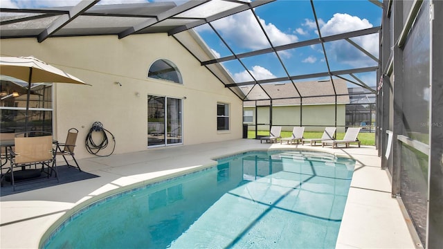 view of pool featuring a lanai and a patio