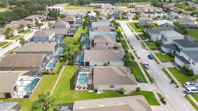birds eye view of property featuring a water view and a residential view