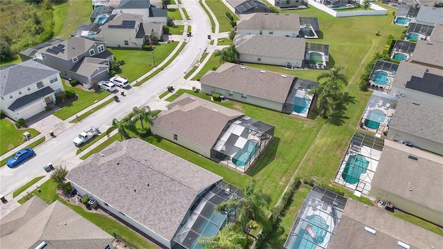birds eye view of property with a residential view