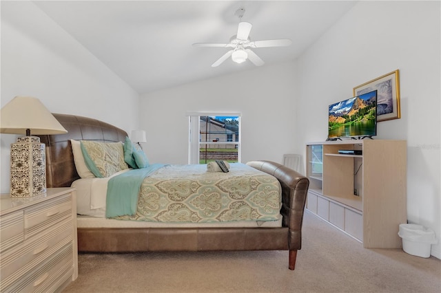 carpeted bedroom featuring ceiling fan and vaulted ceiling