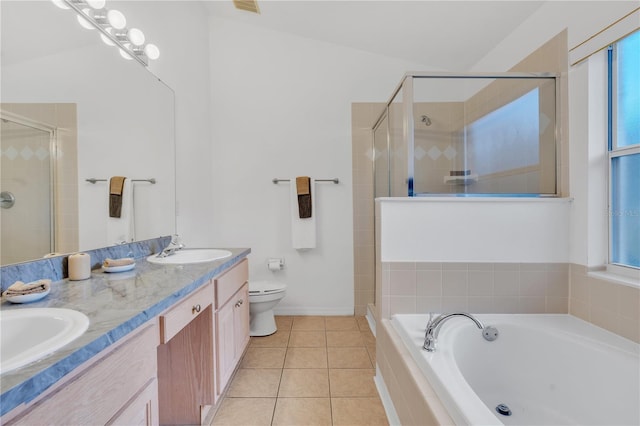 full bathroom with tile patterned flooring, shower with separate bathtub, vanity, and toilet