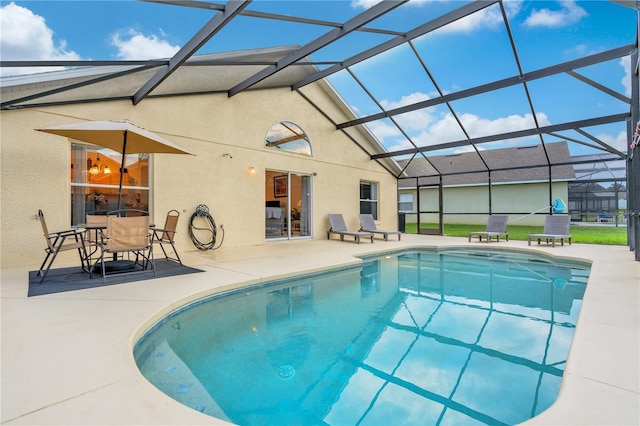 view of pool featuring a lanai and a patio area