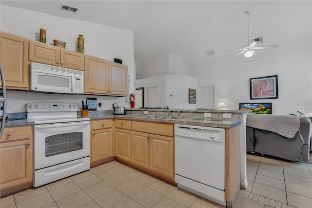 kitchen featuring light brown cabinets, white appliances, sink, and light tile patterned floors