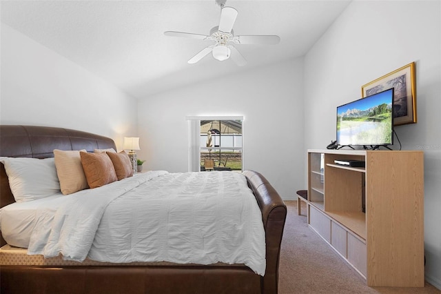 bedroom featuring carpet floors, ceiling fan, and lofted ceiling