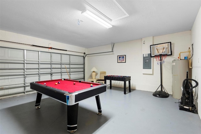 recreation room featuring a textured ceiling, concrete floors, water heater, pool table, and electric panel