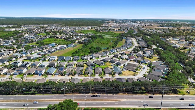 birds eye view of property with a residential view