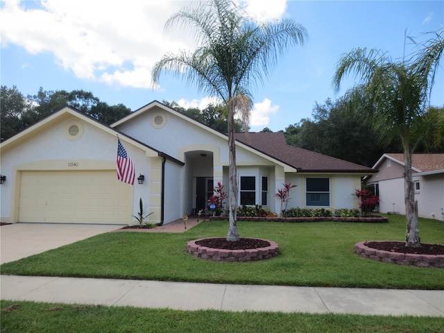11540 Sandy Hill Dr, Orlando, FL 32821 - ranch-style house with an attached garage, stucco siding, driveway, and a front lawn