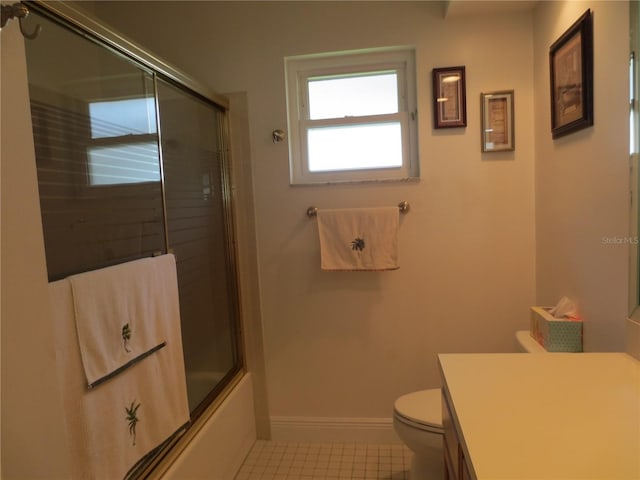 full bathroom with tile patterned floors, vanity, toilet, and enclosed tub / shower combo