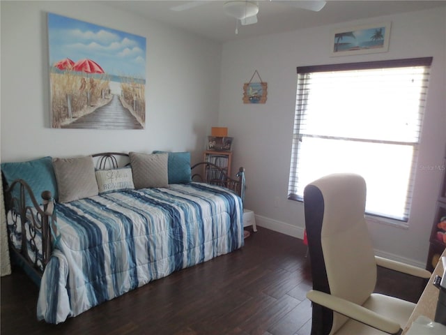 bedroom featuring ceiling fan and dark hardwood / wood-style floors