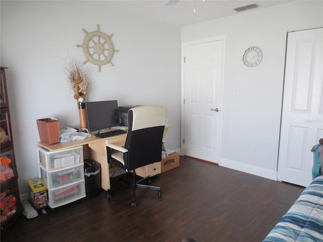 office space with ceiling fan and dark wood-type flooring