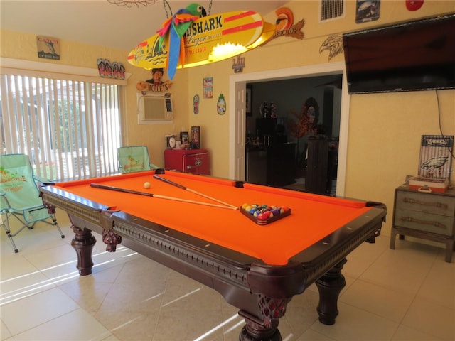 playroom featuring tile patterned floors, an AC wall unit, and billiards