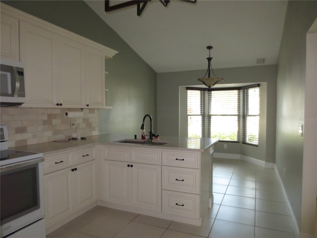 kitchen with kitchen peninsula, white range with electric cooktop, lofted ceiling, and sink