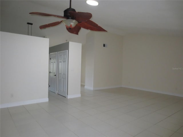 unfurnished room featuring ceiling fan and light tile patterned flooring