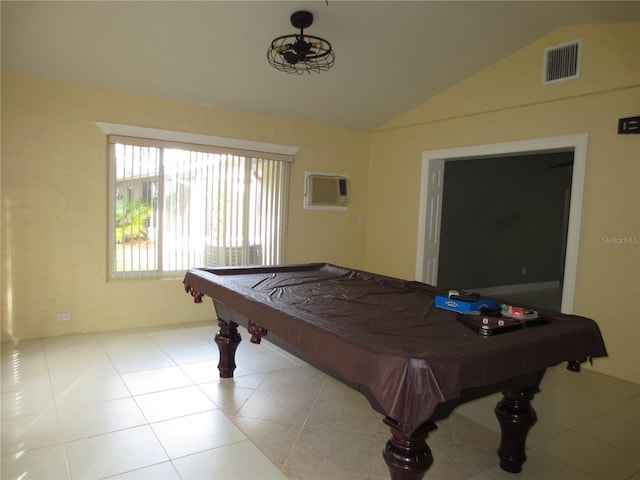 game room featuring a wall mounted AC, light tile patterned floors, vaulted ceiling, and billiards