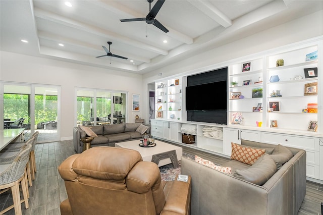 living room featuring dark wood-type flooring, ceiling fan, and beam ceiling