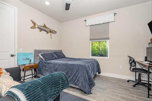 bedroom featuring light hardwood / wood-style flooring and ceiling fan