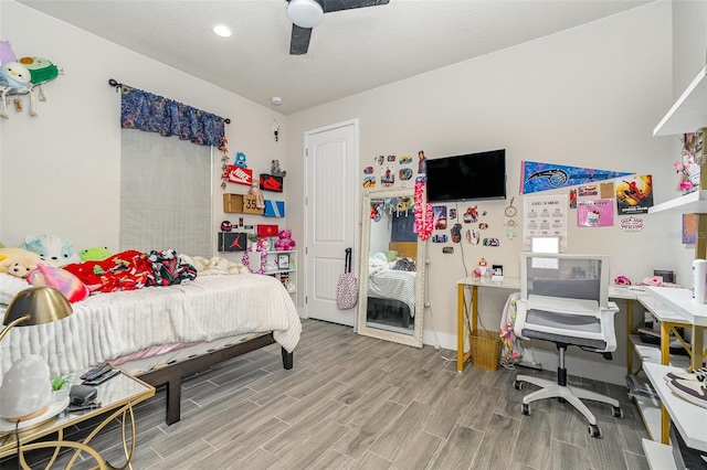 bedroom featuring hardwood / wood-style floors and ceiling fan