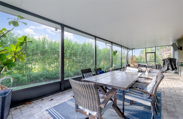 sunroom / solarium featuring plenty of natural light