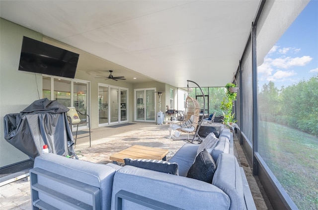 sunroom / solarium with ceiling fan