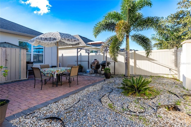 view of patio featuring a shed