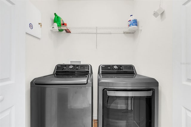 clothes washing area with independent washer and dryer