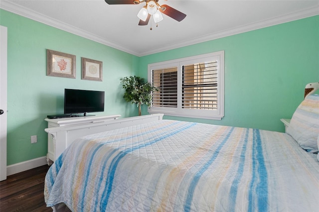 bedroom with crown molding, dark hardwood / wood-style floors, and ceiling fan