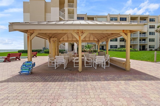 view of patio / terrace with a balcony and a gazebo