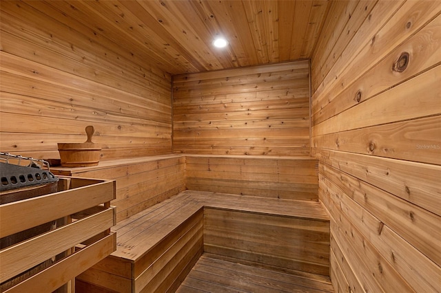 view of sauna / steam room with wooden walls and wood ceiling