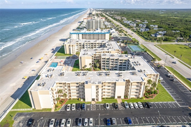 birds eye view of property featuring a water view and a view of the beach