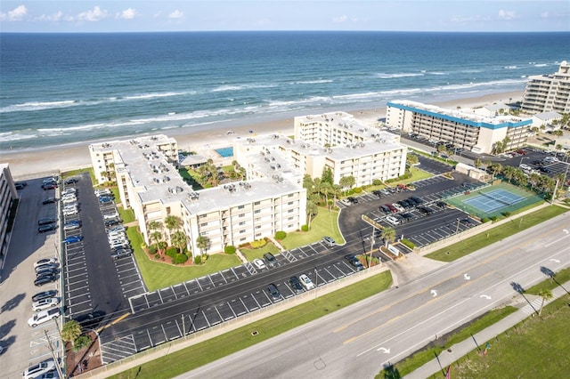 birds eye view of property with a view of the beach and a water view