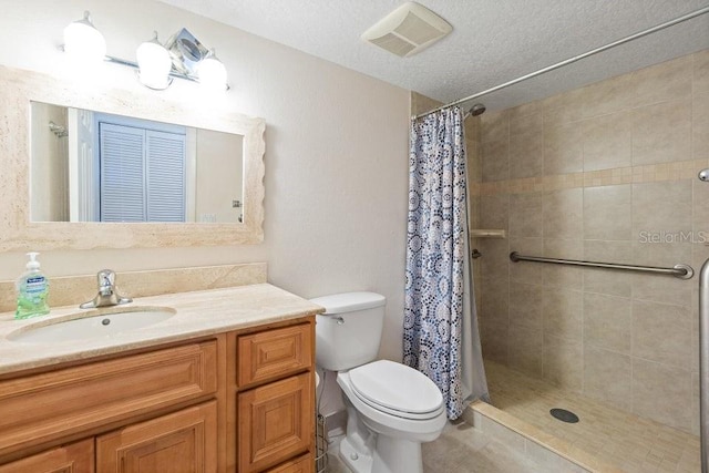 bathroom featuring toilet, a shower with curtain, and vanity