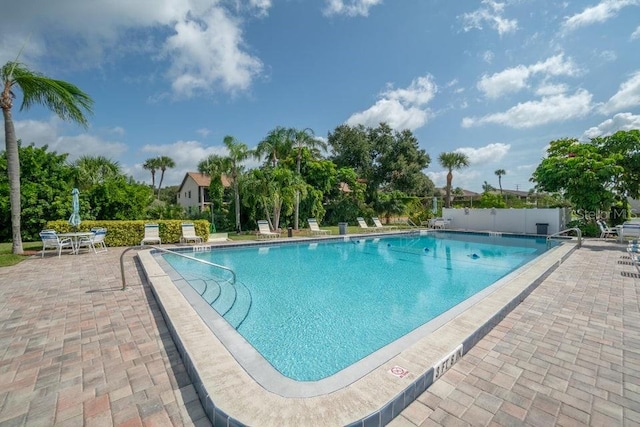 view of swimming pool with a patio