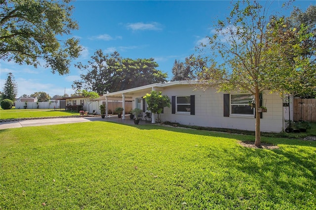 ranch-style house with a front yard