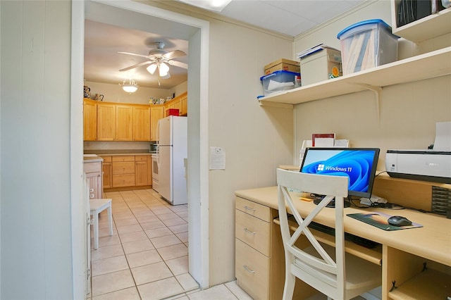 kitchen featuring ceiling fan, light brown cabinetry, light tile patterned floors, and white refrigerator