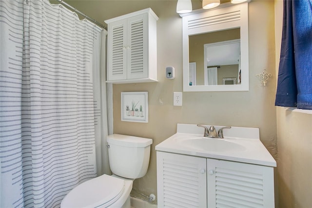 bathroom with toilet and vanity