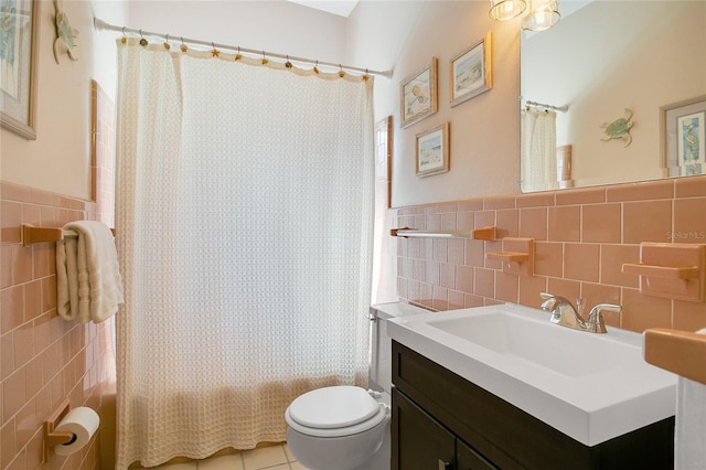 full bathroom featuring tile walls, vanity, and toilet