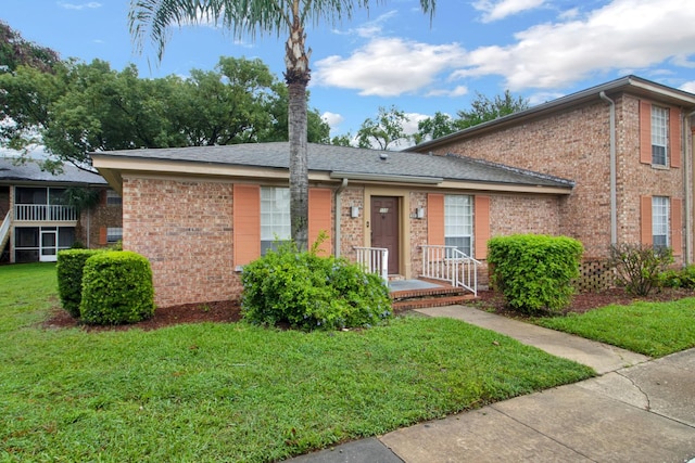 view of front of property with a front lawn