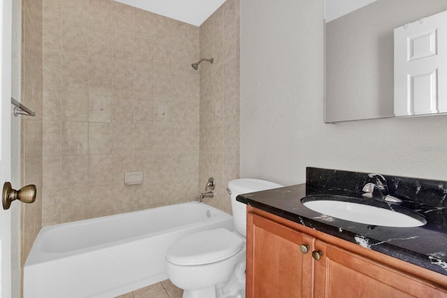 full bathroom with vanity, tiled shower / bath, toilet, and tile patterned flooring