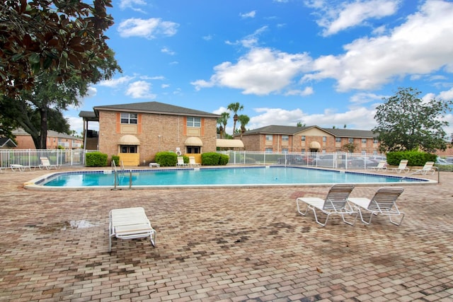 view of swimming pool with a patio