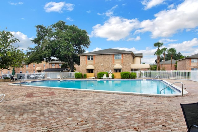 view of swimming pool featuring a patio