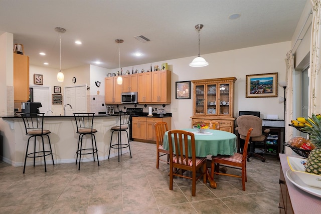 dining room with light tile patterned flooring