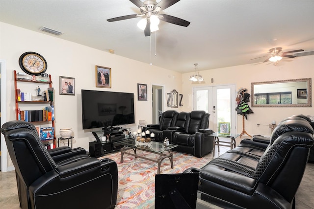 living room featuring ceiling fan and french doors