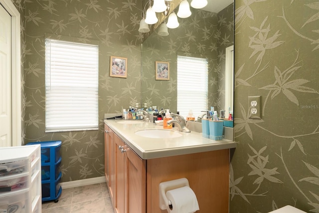 bathroom featuring tile patterned flooring and vanity