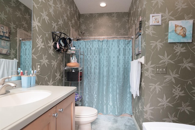 bathroom with vanity, toilet, and a shower with shower curtain